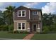 Two-story home with stone accents and landscaping at 5318 Center Lake Ranch Blvd, St Cloud, FL 34771