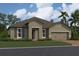 Charming single-story home with a welcoming front porch and landscaped yard at 5385 Park Guell St, St Cloud, FL 34771