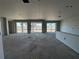 Open main living area under construction with large windows at 5385 Park Guell St, St Cloud, FL 34771