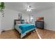 Bedroom with teal bedding and a dresser at 623 Riomar Ave, Orlando, FL 32828