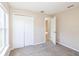 Bright bedroom with carpet and double door closet at 8518 Rainbow Ave, Orlando, FL 32825