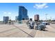 Community patio with seating, grills, and city views at 150 E Robinson St # 3208, Orlando, FL 32801