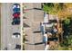 Aerial view of townhouses with parking and surrounding trees at 4522 Brook Hollow Cir, Winter Springs, FL 32708