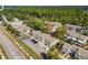 Aerial view of townhome community near road and nature at 4522 Brook Hollow Cir, Winter Springs, FL 32708
