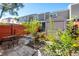 Private patio with seating area, storage shed, and lush landscaping at 4522 Brook Hollow Cir, Winter Springs, FL 32708