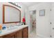 Clean bathroom with vanity, shower, and decorative accents at 4522 Brook Hollow Cir, Winter Springs, FL 32708