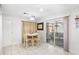 Small dining area with table and chairs near sliding door at 4522 Brook Hollow Cir, Winter Springs, FL 32708