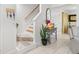 Staircase and entryway with decor and plants at 4522 Brook Hollow Cir, Winter Springs, FL 32708