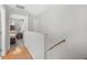 Upstairs hallway with wood floors and access to bedrooms at 4522 Brook Hollow Cir, Winter Springs, FL 32708