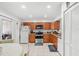 Kitchen with stainless steel appliances and wood cabinets at 4522 Brook Hollow Cir, Winter Springs, FL 32708