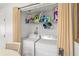 Compact laundry room with washer, dryer, and shelving at 4522 Brook Hollow Cir, Winter Springs, FL 32708