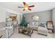 Living room with sectional sofa and Christmas tree at 4522 Brook Hollow Cir, Winter Springs, FL 32708