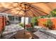 Relaxing patio space with table and umbrella, perfect for outdoor dining at 4522 Brook Hollow Cir, Winter Springs, FL 32708