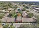 Aerial view of a community of townhouses with ample parking and lush landscaping at 4786 Tangerine Ave # 4786, Winter Park, FL 32792