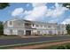 Townhouse-style home with two-car garage and neutral color palette at 5086 Rain Shadow Dr, St Cloud, FL 34772
