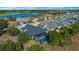 Aerial view showcasing a house with a pool and surrounding community at 5466 Nw 35Th Lane Rd, Ocala, FL 34482