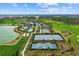 Aerial view showcasing tennis courts, pickleball courts, pool, and golf course at 5466 Nw 35Th Lane Rd, Ocala, FL 34482