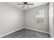 Well-lit bedroom with gray carpet and ceiling fan at 6886 Wilson Hammock Ave, Groveland, FL 34736