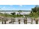 Lake access with a scenic walking path and gazebo at 6886 Wilson Hammock Ave, Groveland, FL 34736