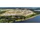 Large community with lakefront access and various housing styles at 6886 Wilson Hammock Ave, Groveland, FL 34736