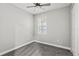 Simple bedroom with gray carpet and ceiling fan at 6886 Wilson Hammock Ave, Groveland, FL 34736