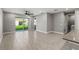 Bright living room with tile floors and sliding glass doors leading to backyard at 6886 Wilson Hammock Ave, Groveland, FL 34736