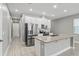 Modern kitchen with stainless steel appliances and island at 6886 Wilson Hammock Ave, Groveland, FL 34736