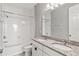 Bathroom with granite countertop, double sinks and bathtub at 6886 Wilson Hammock Ave, Groveland, FL 34736