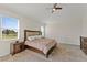 Spacious main bedroom with plush carpeting and large windows at 1142 Trappers Trail Loop, Davenport, FL 33896