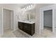 Double vanity bathroom with neutral tones and ample storage at 1142 Trappers Trail Loop, Davenport, FL 33896