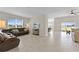 Spacious living area with a view of the backyard and a comfy couch at 1142 Trappers Trail Loop, Davenport, FL 33896