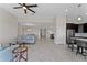 Modern kitchen with dark cabinetry, stainless steel appliances, and an island at 1142 Trappers Trail Loop, Davenport, FL 33896