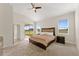 Main bedroom with sliding door to backyard and ample natural light at 1142 Trappers Trail Loop, Davenport, FL 33896