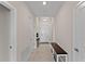 An entryway with tile floors, a bench, and a view to the living room at 1142 Trappers Trail Loop, Davenport, FL 33896