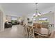 Spacious dining room with an open floor plan and view of the kitchen and living room at 1142 Trappers Trail Loop, Davenport, FL 33896