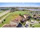 Aerial view of house and green space at 1142 Trappers Trail Loop, Davenport, FL 33896