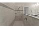 Large walk-in shower with tile surround and built-in shelves at 1142 Trappers Trail Loop, Davenport, FL 33896