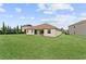 Spacious backyard with grassy lawn at 1142 Trappers Trail Loop, Davenport, FL 33896