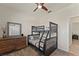 Bedroom with full-over-full bunk bed and ceiling fan at 1142 Trappers Trail Loop, Davenport, FL 33896