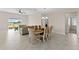 Bright dining area with a view of the backyard and access to the living room at 1142 Trappers Trail Loop, Davenport, FL 33896