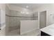 Walk-in shower with modern tile and glass enclosure at 1142 Trappers Trail Loop, Davenport, FL 33896