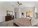Main bedroom with access to private patio and walk-in closet at 1142 Trappers Trail Loop, Davenport, FL 33896