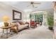 Living room with hardwood floors and lots of natural light at 12843 Madison Pointe Cir # 107, Orlando, FL 32821