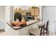 Modern kitchen with breakfast bar and view of living area at 12843 Madison Pointe Cir # 107, Orlando, FL 32821