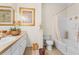 Bathroom with tub, shower, and double vanity at 12843 Madison Pointe Cir # 107, Orlando, FL 32821