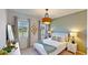 Cozy bedroom with light walls and teal accents at 2277 Derwent Dr, Davenport, FL 33896