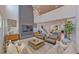 Open living room showcasing a statement fireplace and high ceilings at 2277 Derwent Dr, Davenport, FL 33896