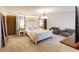 Spacious main bedroom with a plush bed and seating area at 2277 Derwent Dr, Davenport, FL 33896