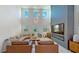 Spacious living room with a modern fireplace and high ceilings at 2277 Derwent Dr, Davenport, FL 33896