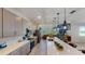 Modern kitchen features stainless steel appliances and an expansive island at 2277 Derwent Dr, Davenport, FL 33896